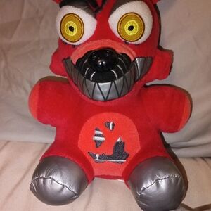 Red and Silver Plush Toy